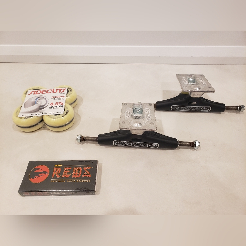2 Krux Skateboard Trucks, Bones Reds Bearings, 4 Sidecuts Wheels